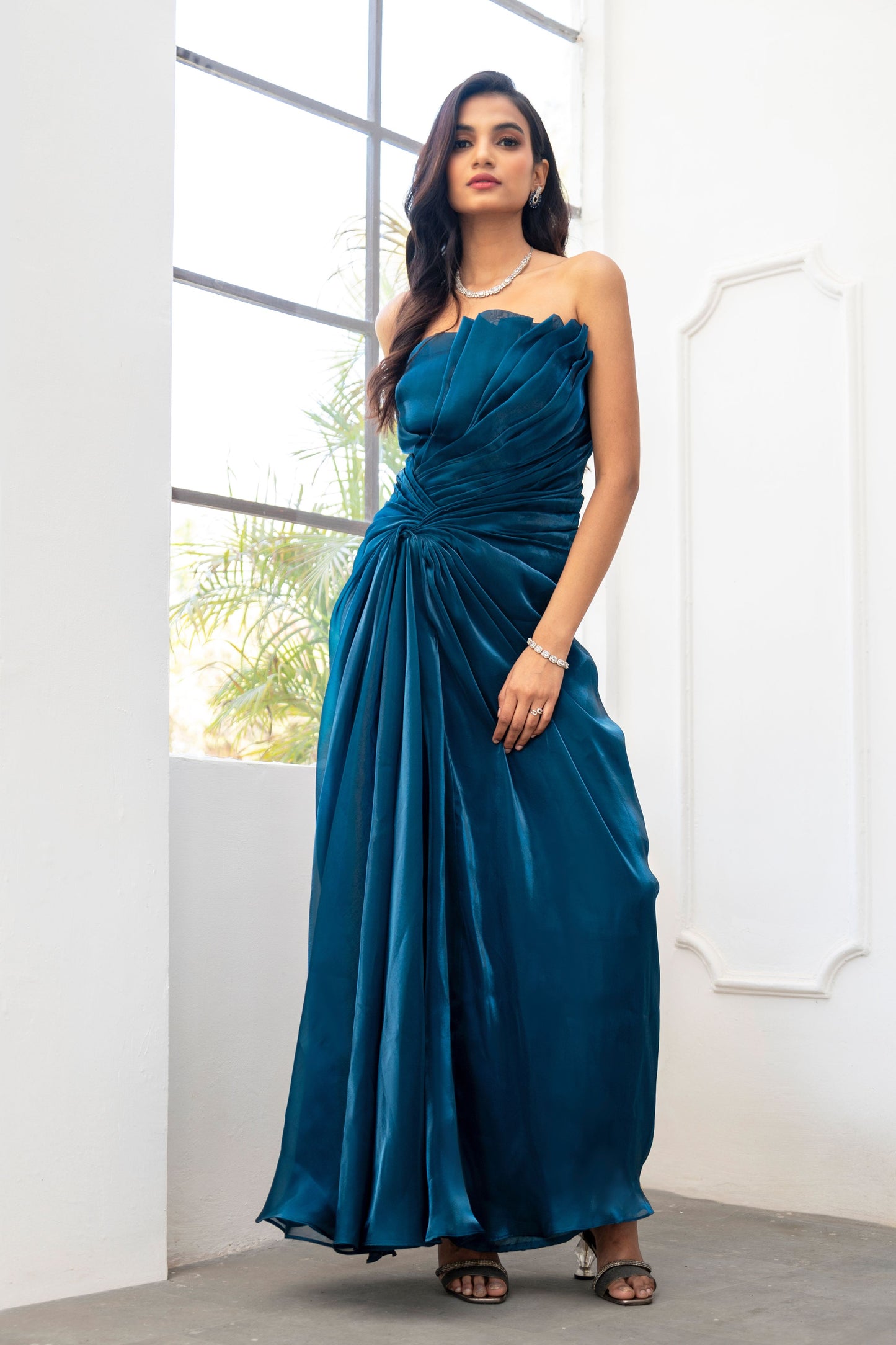Teal draped evening gown
