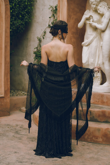 Black embroidered draped evening gown