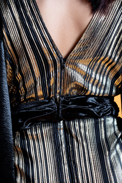 Black and gold long sleeve draped evening gown